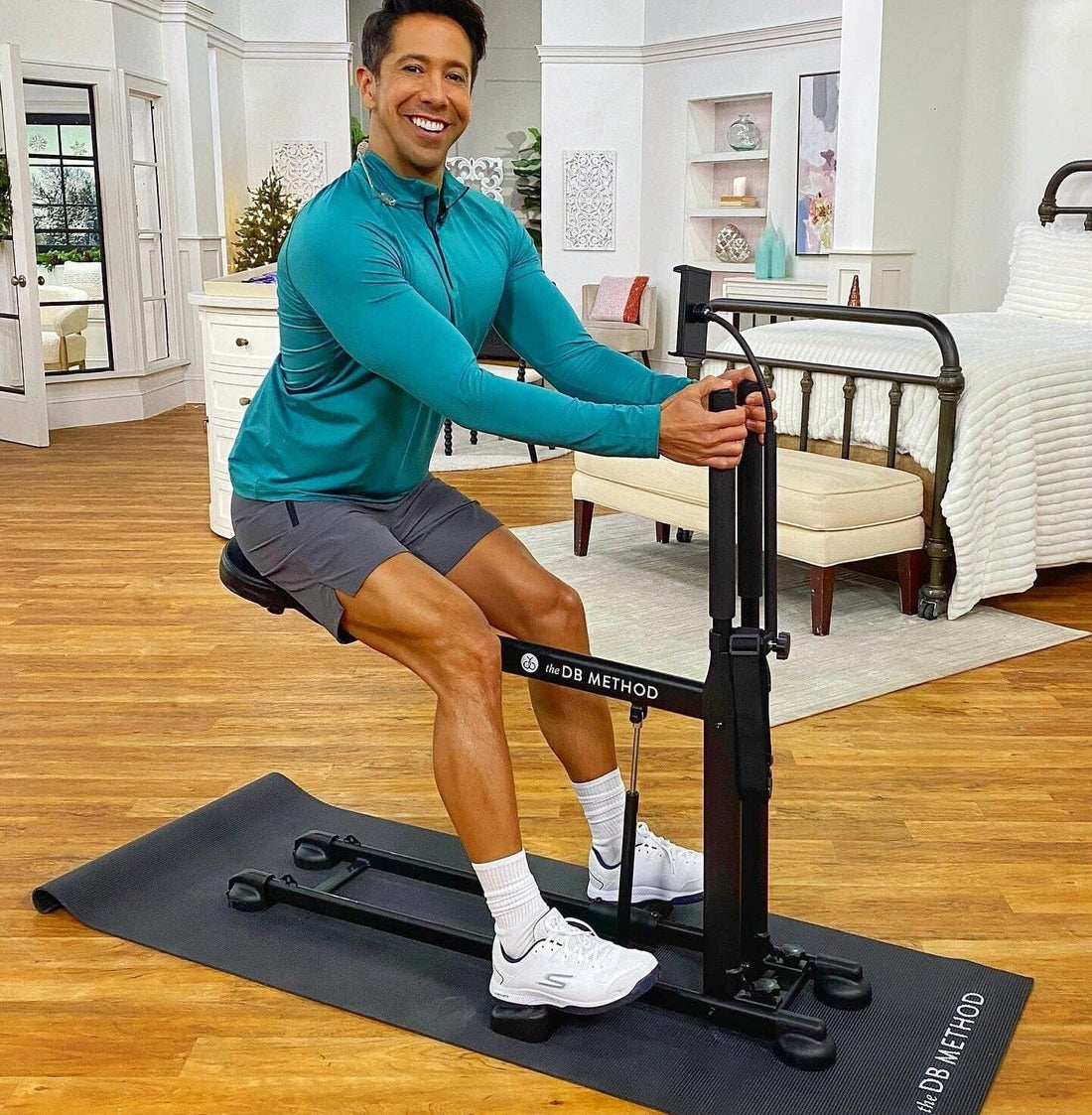 Man working out with The DB Method machine indoors, showing strong glutes and toned legs.