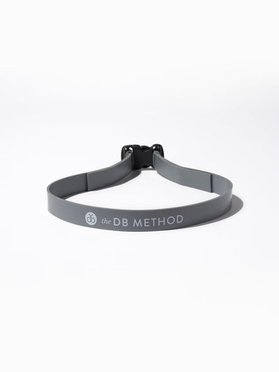 A resistance band offering adjustable tension for customized workout intensity with The DB Method.